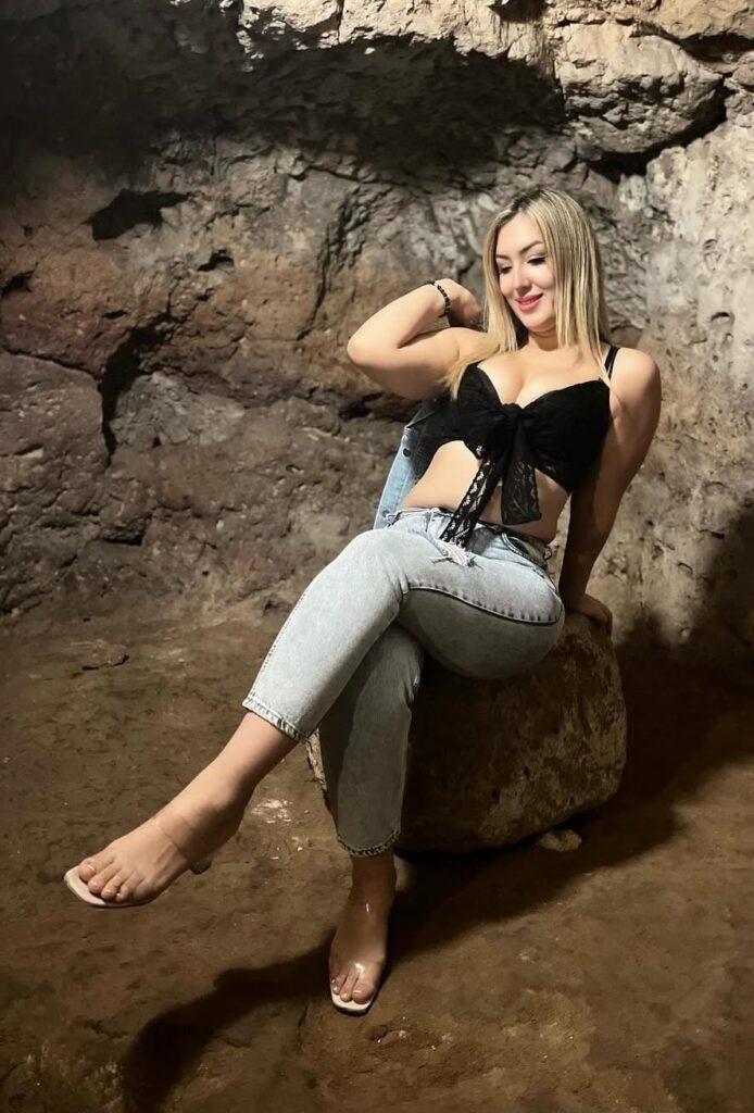 An escort girl sits in the chair to showing it's boldness