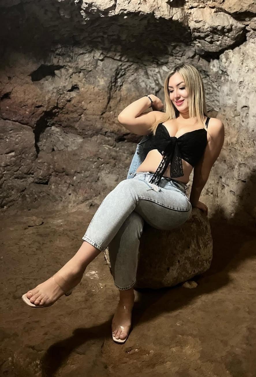 An escort girl sits in the chair to showing it's boldness