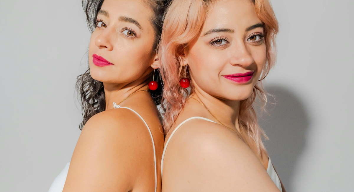 Modern lifestyle image of two women in stylish appearance