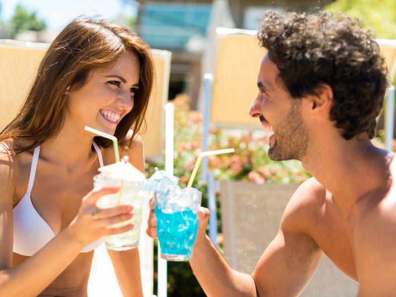 Couple enjoying drinks with escort services in Aerocity